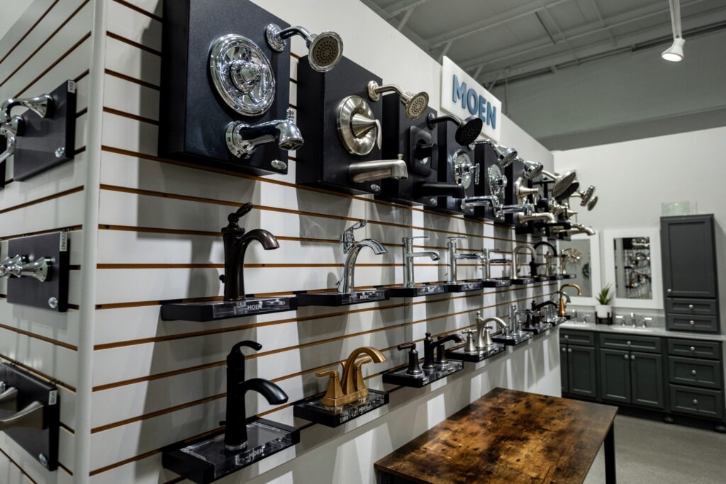 Faucet heads & Shower heads on display in brass, nickel, brushed gold and matte black in the Simple Kitchen and Bath Showroom.